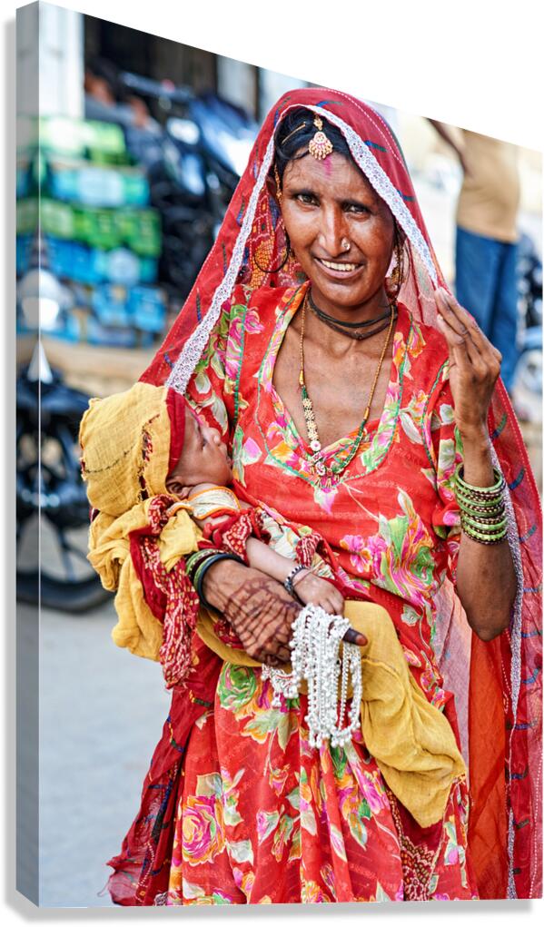 Woman with baby in Jaisalmer Rajasthan marketplace