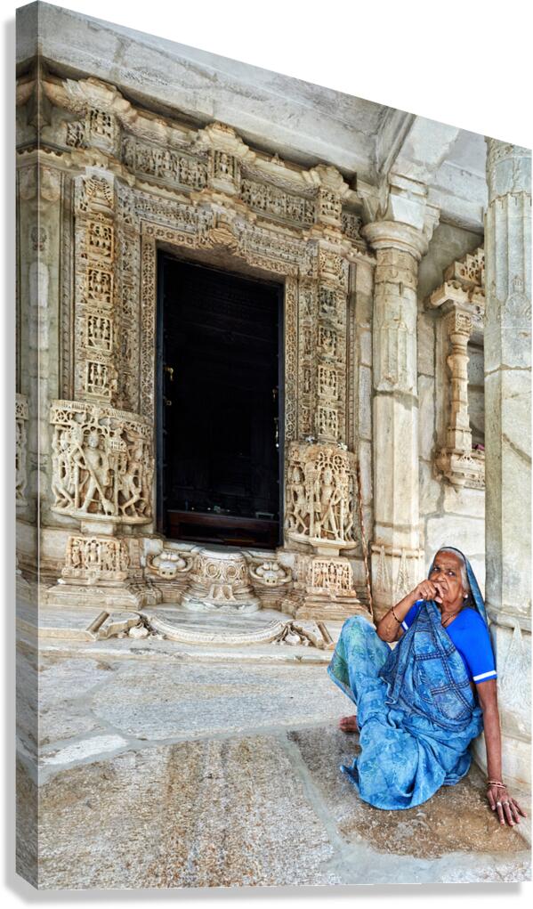 Old Jain temples in Ranakpur Rajasthan with a woman resting