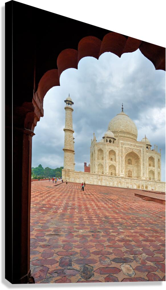 Exploring the view of Taj Mahal from an archway in Agra