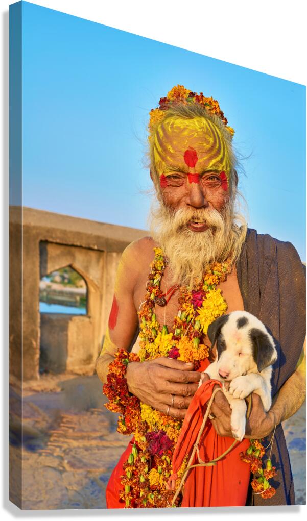 Holy man with puppy in Orchha Madhya Pradesh India