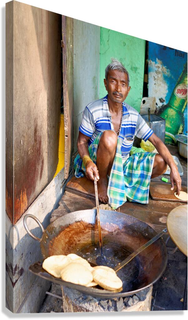 Cooking sweets in Varanasi street market during daytime