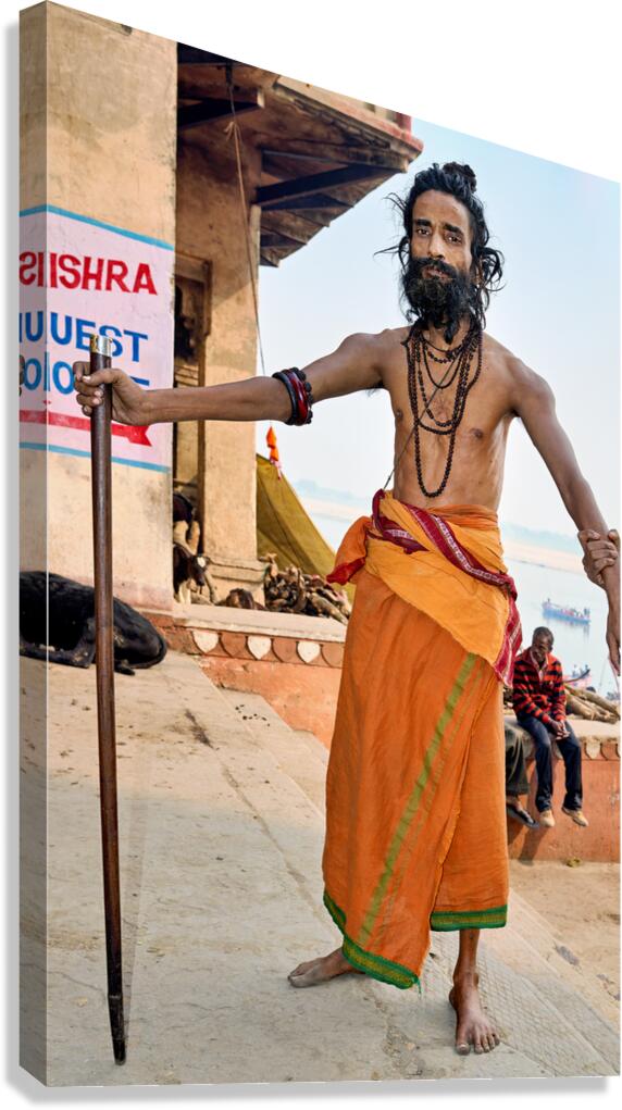 Sadhu stands near the Ganges River in Varanasi India