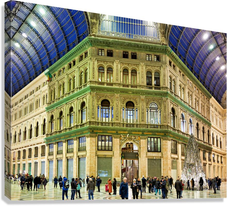 Visitors explore Galleria Umberto I in Naples during a busy day