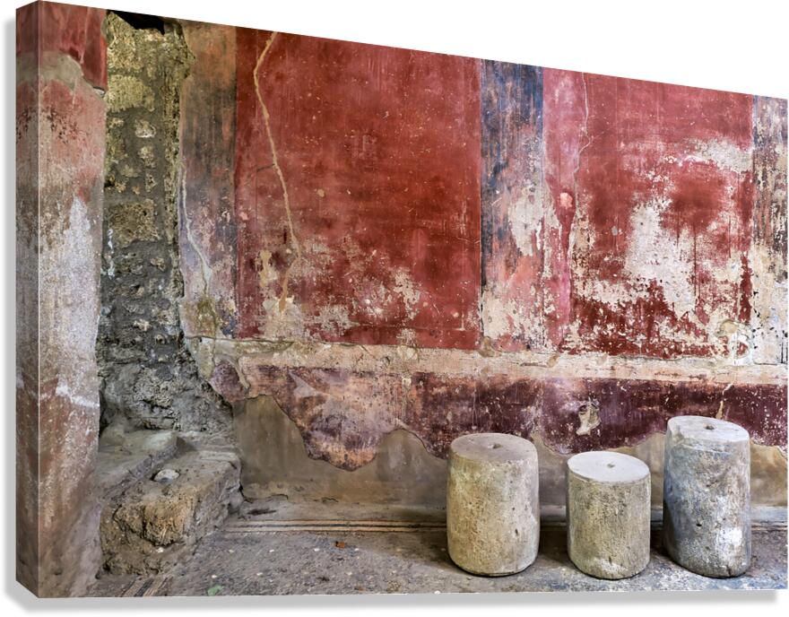Pompeii site with stone seats and worn wall in Naples Italy