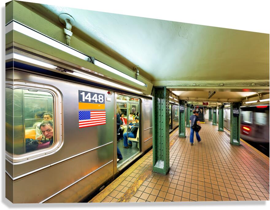 People wait at Manhattan subway station in New York City