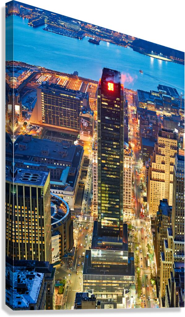 Aerial view of Manhattan at dusk showing city lights and buildin