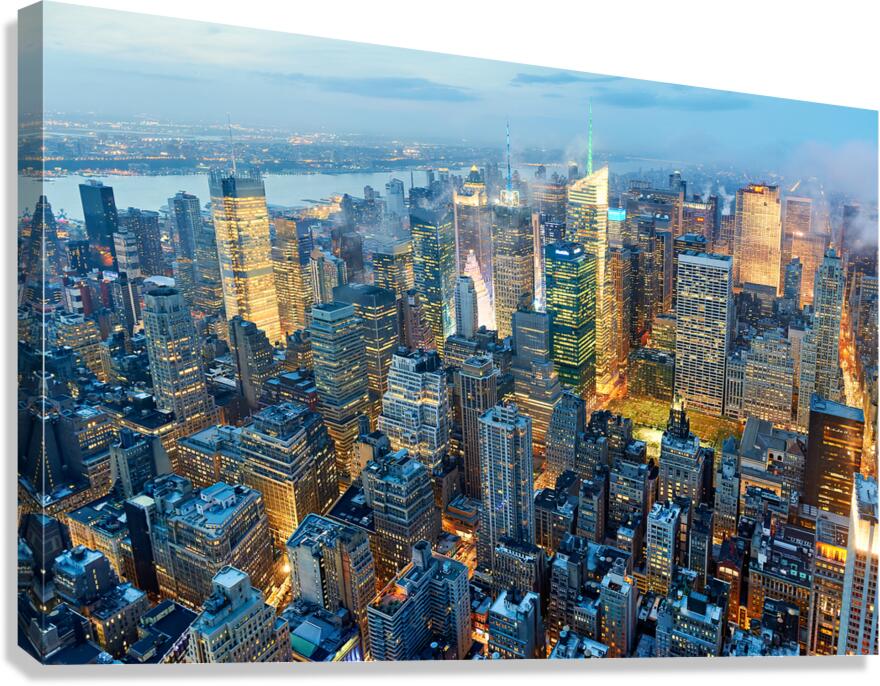 Aerial view of Manhattan in New York at dusk with city lights