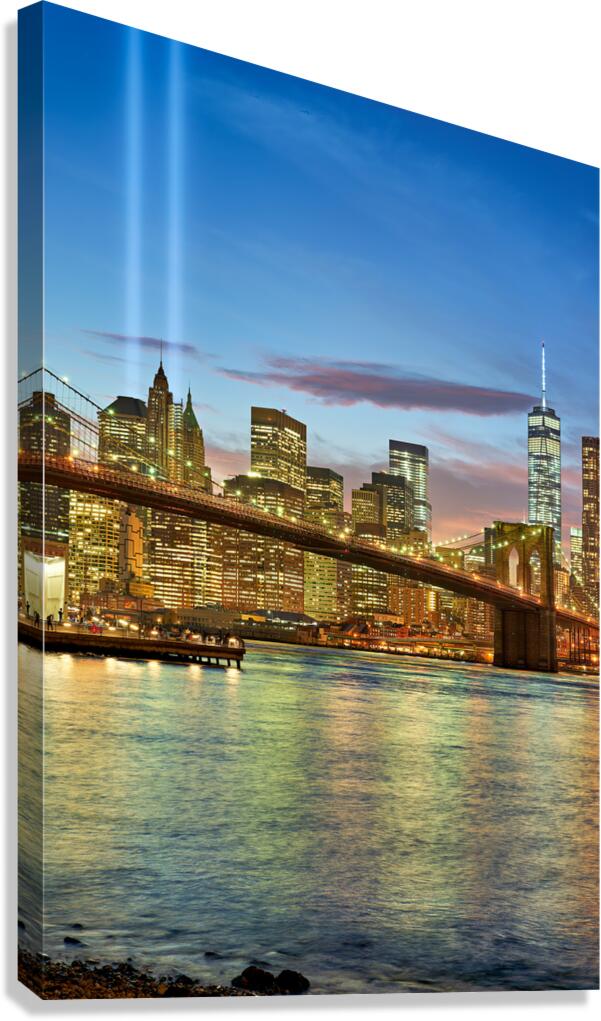 Tribute in Light shines over Manhattan skyline at dusk