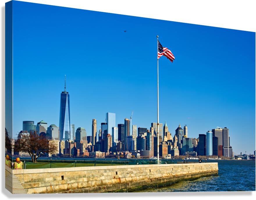 Manhattan skyline view from Liberty Island with American flag