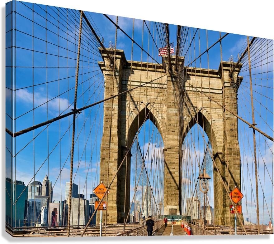 Walking on Brooklyn Bridge in New York City on a clear day