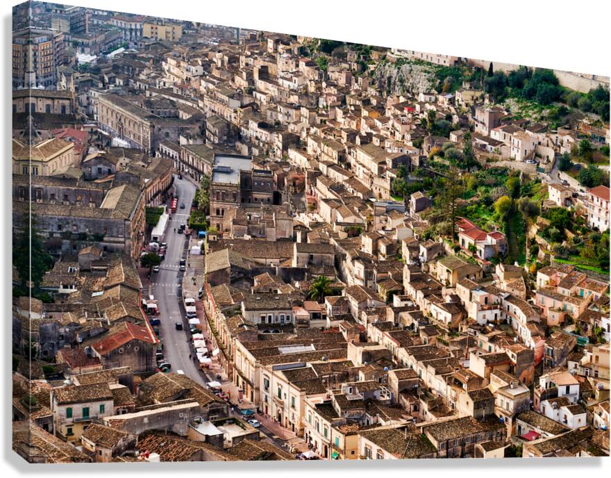 View of Modica in Sicily with buildings and streets built on hil