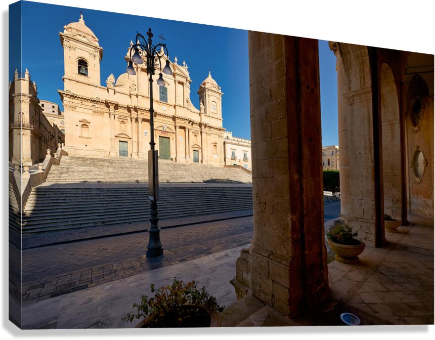 Noto Cathedral stands tall in Sicily under a clear blue sky