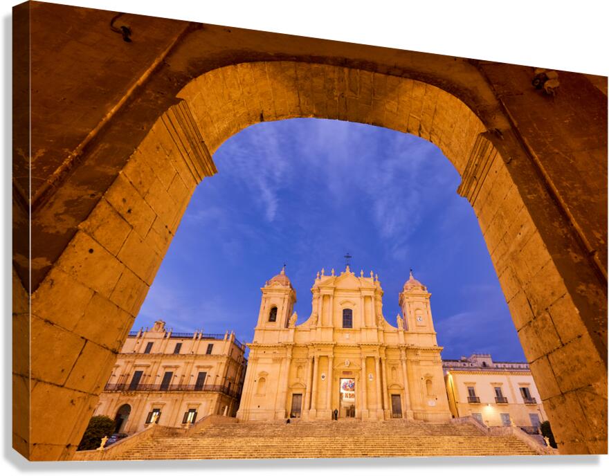 Noto Cathedral in Sicily at dusk under a colorful sky