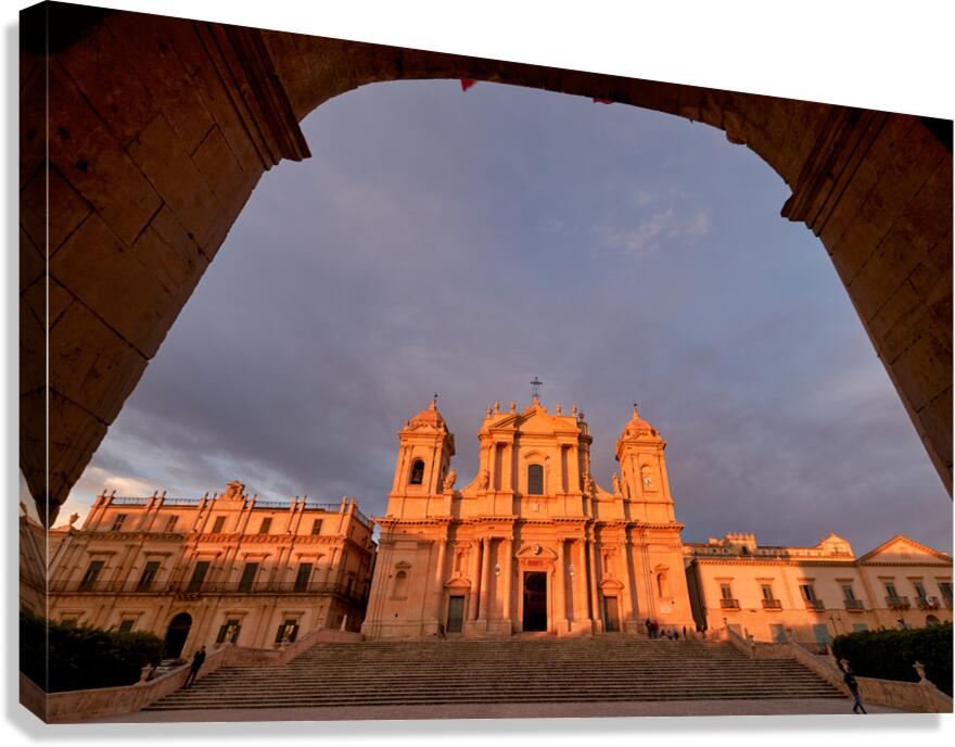 Noto Cathedral in Sicily Italy during sunset with archway view