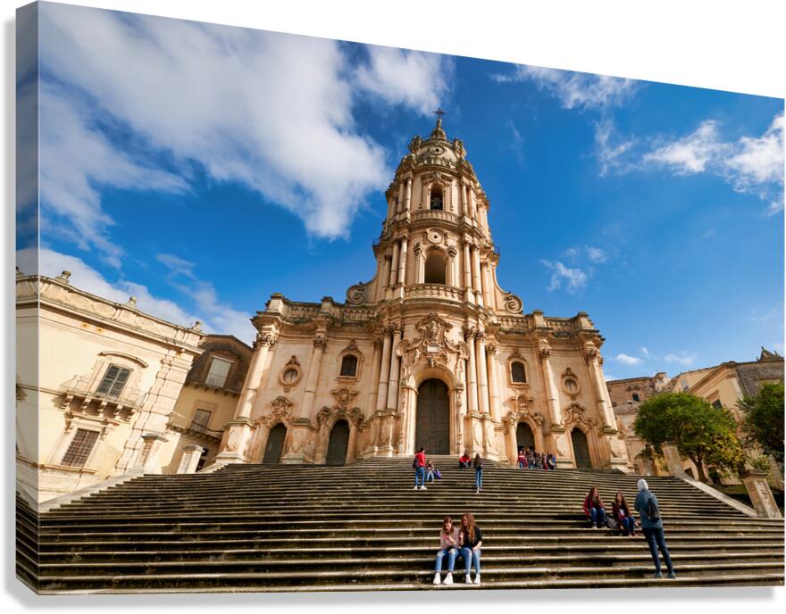 Duomo of San Giorgio stands tall in Modica Sicily under blue sk