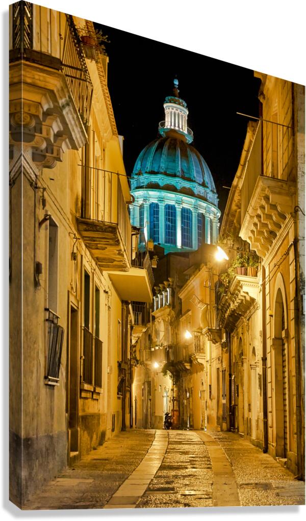 Duomo of San Giorgio shines at night in Modica Sicily Italy