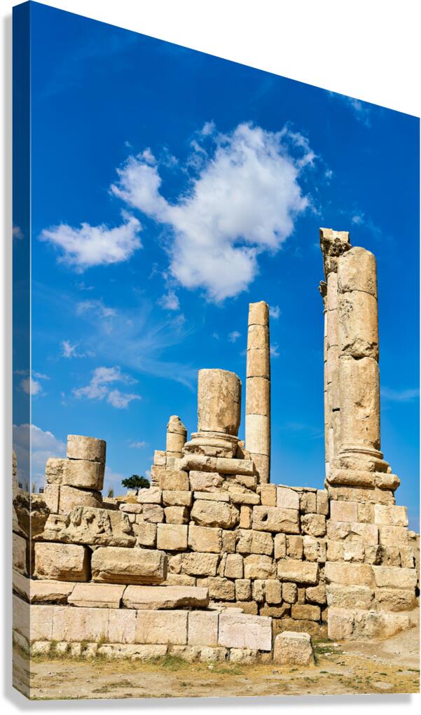 Exploring ancient ruins at Citadel in Amman Jordan under blue sk