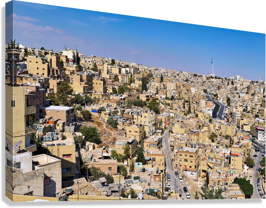 Cityscape of Amman Jordan with buildings and roads under blue sk