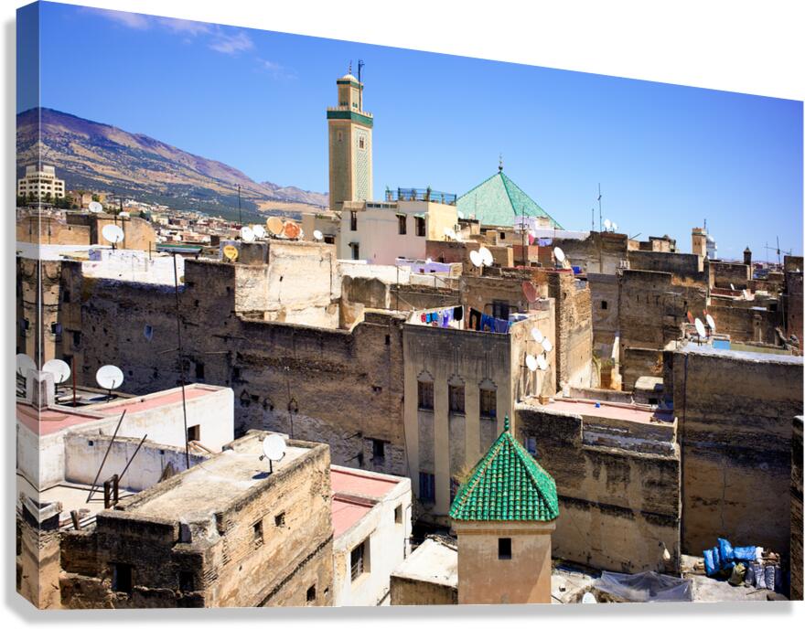 Elevated view of Medina in Fez Morocco with rooftops and mounta