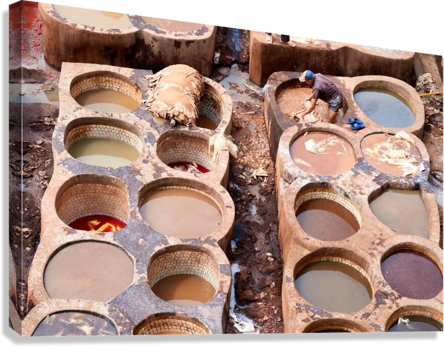 Workers processing leather at Chouara Tannery in Fez Morocco
