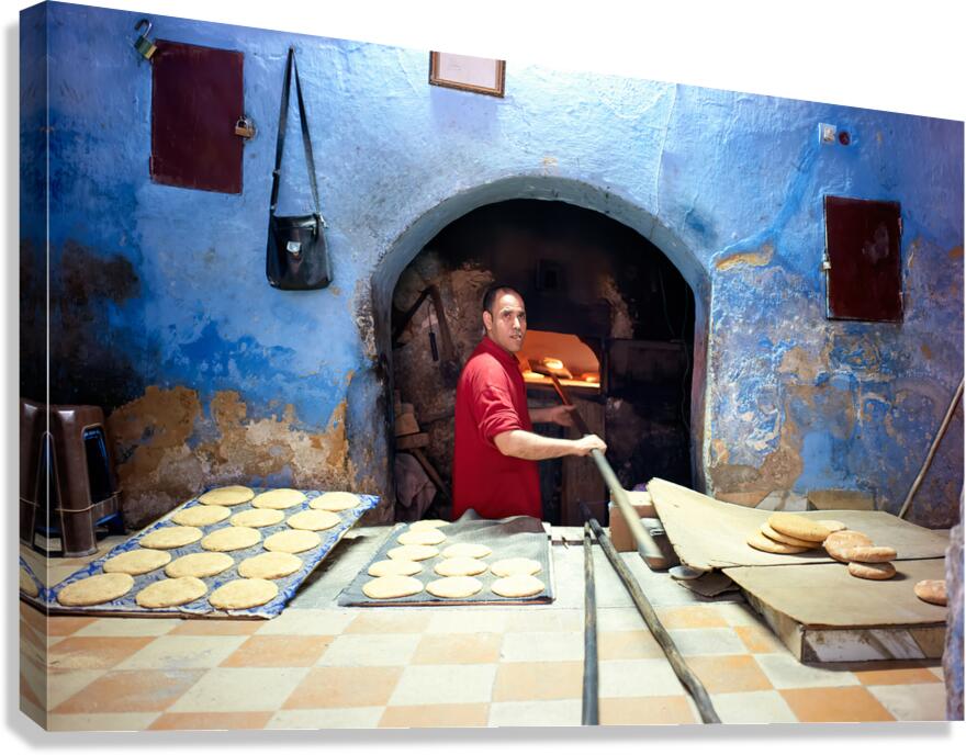Baker makes traditional bread in Fez Morocco