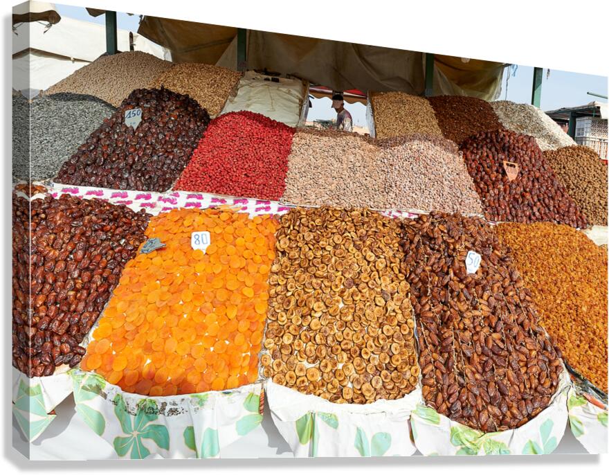 Fruit vendors sell dried fruit in Marrakesh Morocco