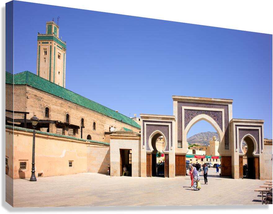 Visitors walk through Bab Rcif gate in Fez Morocco during the d