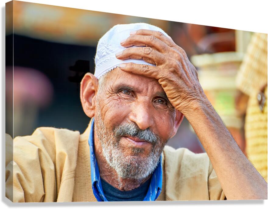 Man smiles at market in Marrakesh Morocco in bright daylight