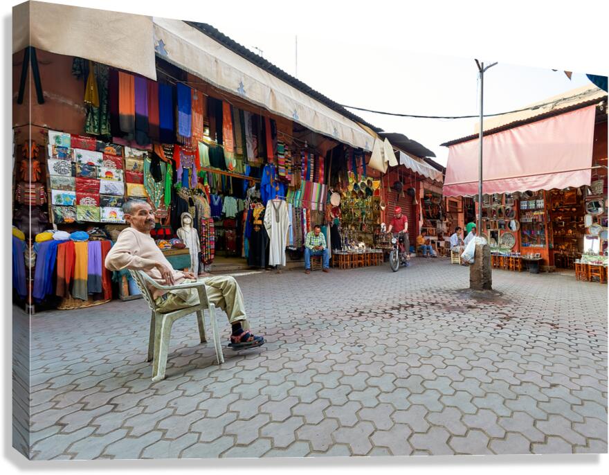 Shops in the Medina of Marrakesh with people and goods on displa