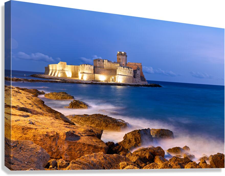 Sunset reveals Aragon castle at Le Castella in Calabria Italy