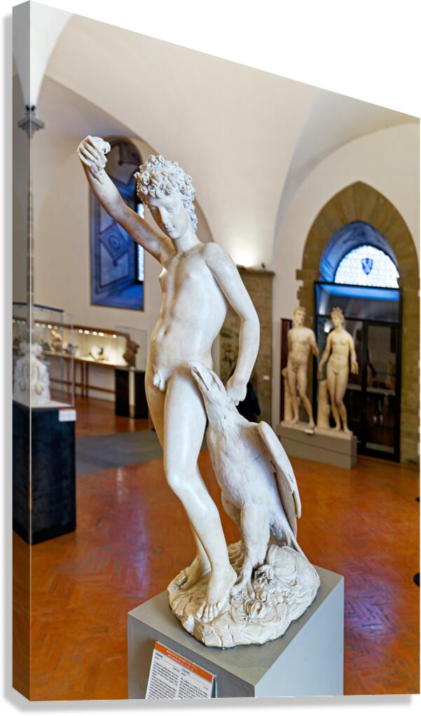 A sculpture of Ganimede holding a cup while standing on a bird