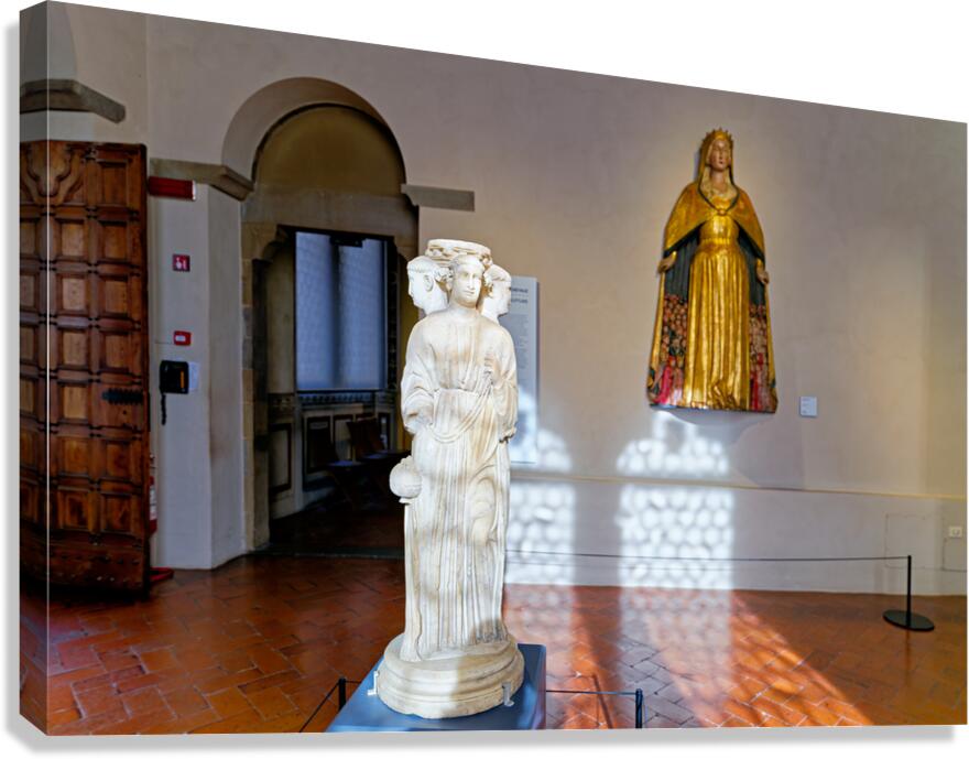 Visitors admire artwork in Museo Nazionale del Bargello Florence
