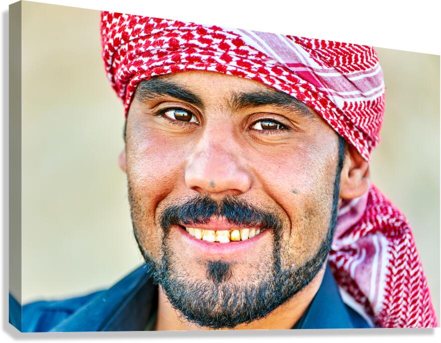 Portrait of a young man in Syria wearing a traditional headscarf