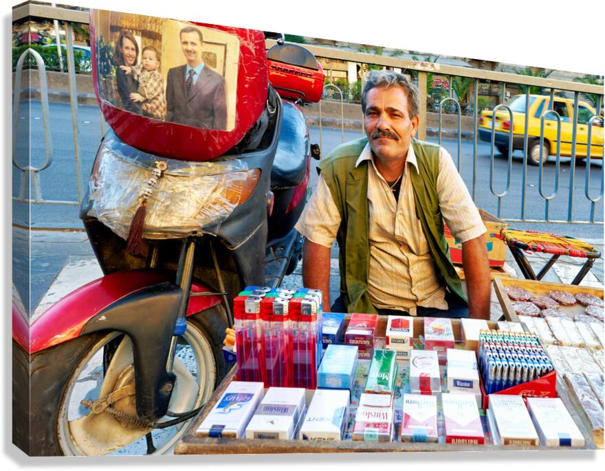 Man selling cigarettes near his motorcycle in Damascus Syria
