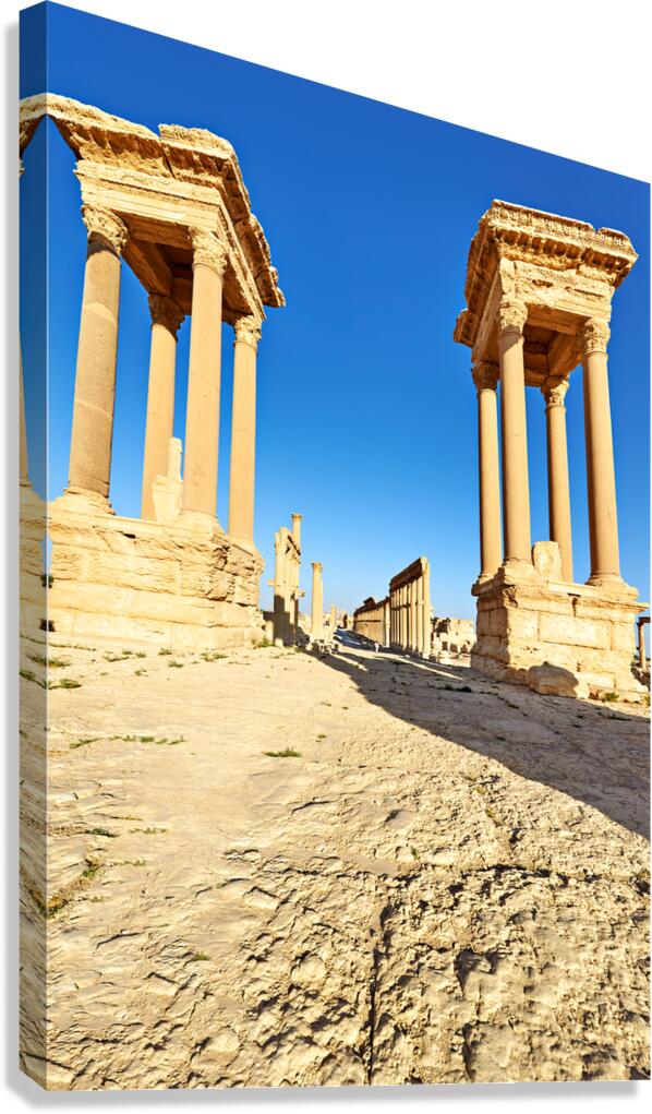 Exploring Palmyras ancient tetrapylon in Syria at noon