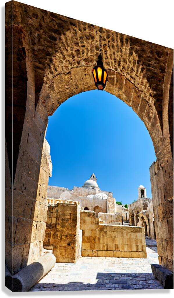 View of the citadel in Aleppo and the sky above from an archway