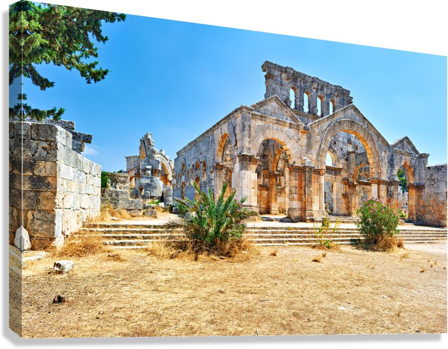 Visitors explore the ruins of Church of Saint Simeon Stylites in