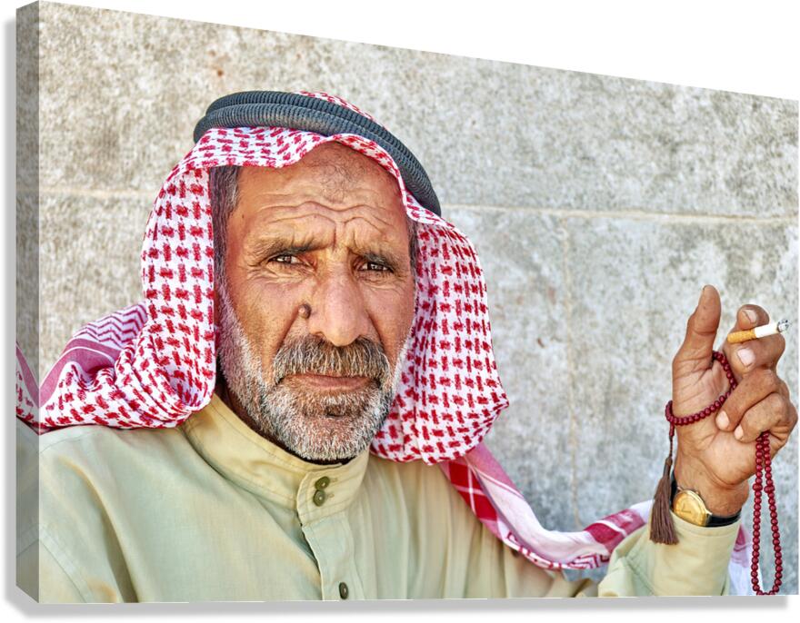 Portrait of a senior man sitting in Aleppo Syria with prayer be