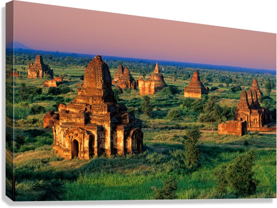 Explore temples in Bagan during sunset with green fields around