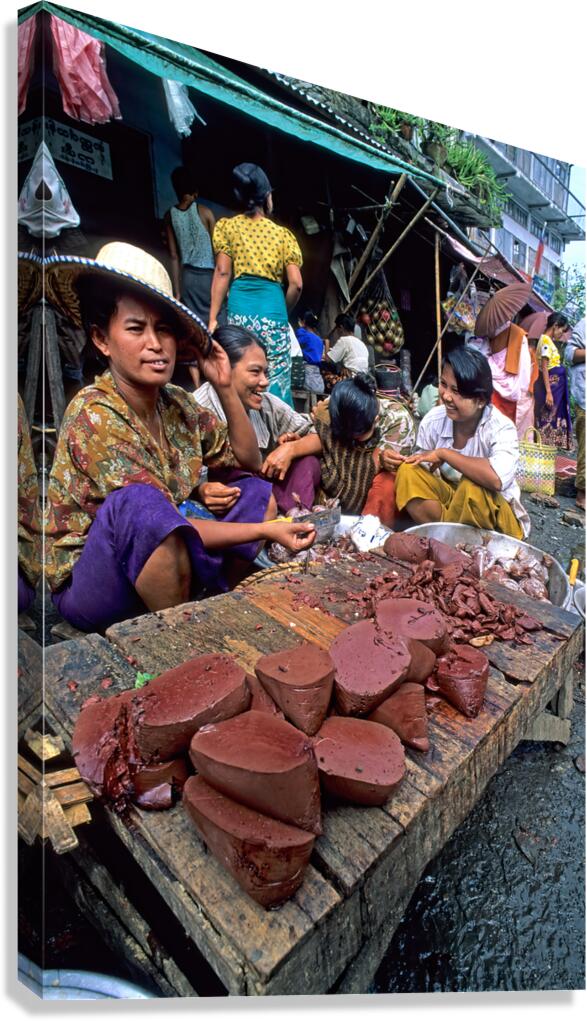 Market scene in Yangon showing vendors selling food items