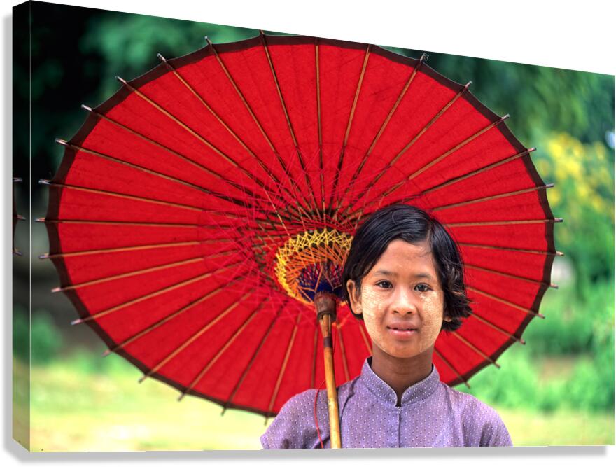 Portrait of girl holding red umbrella in Myanmar