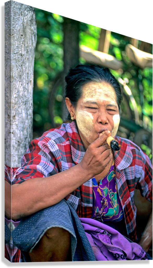 Portrait of a woman smoking in Myanmar during a sunny day