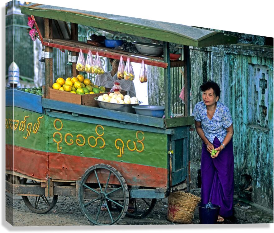 Fruit vendor at street market in Yangon during the day