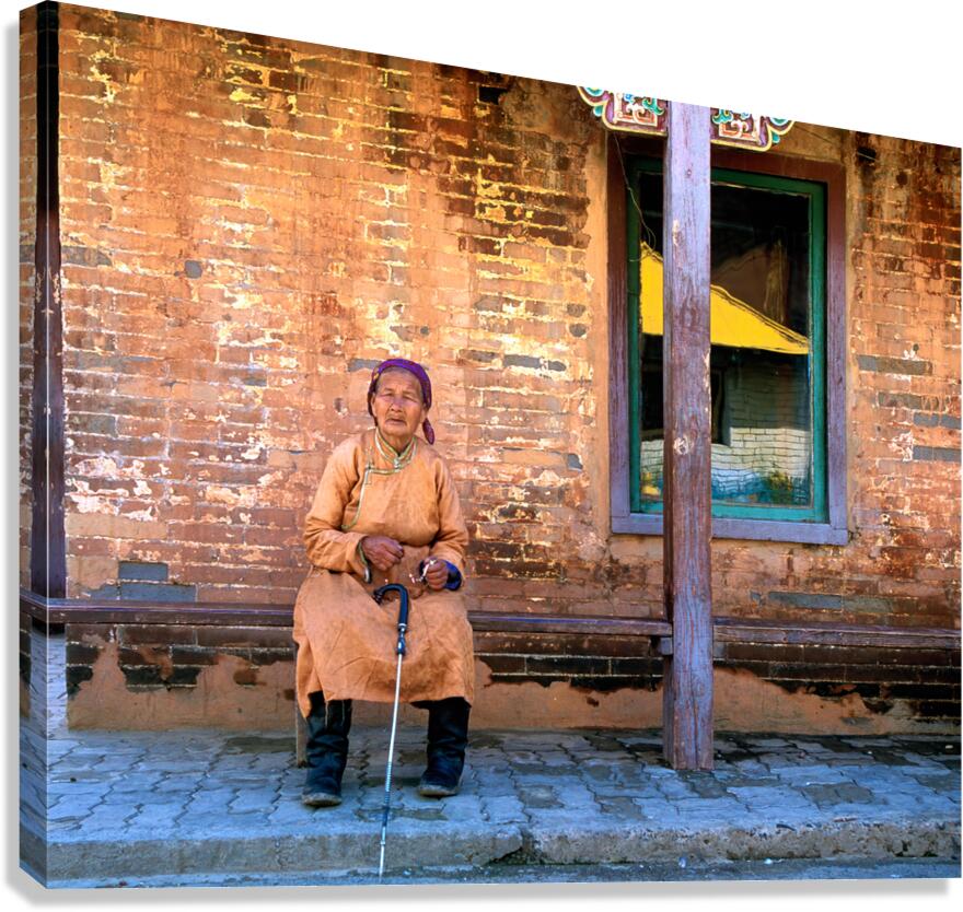 Old woman sits at Gandantegchinlen Monastery in Ulaanbaatar Mon