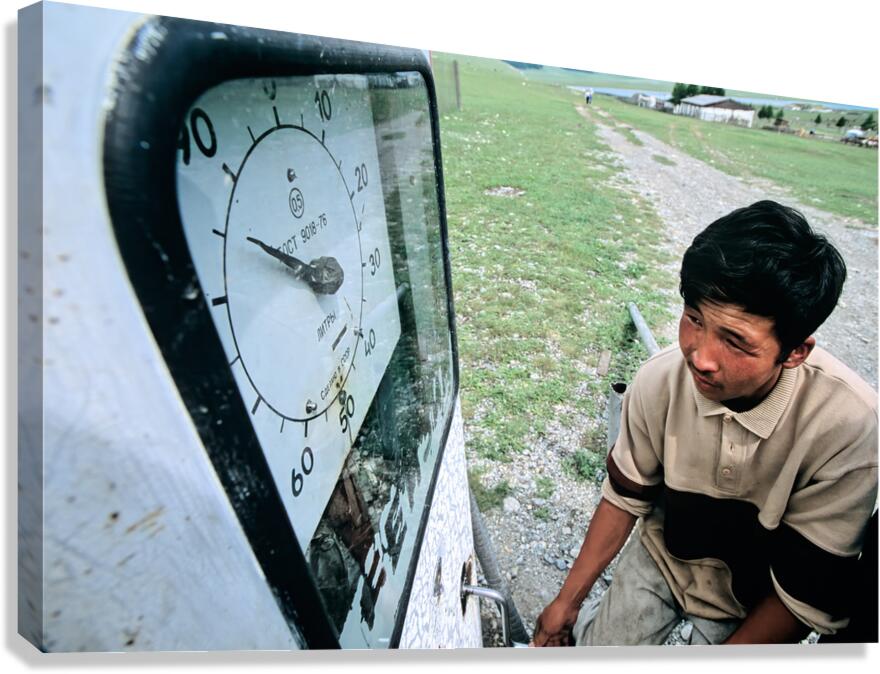 Vintage petrol station in Mongolia with a young man filling up