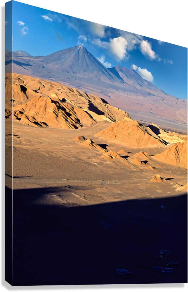 Dramatic desert landscape with mountains rock formations and s