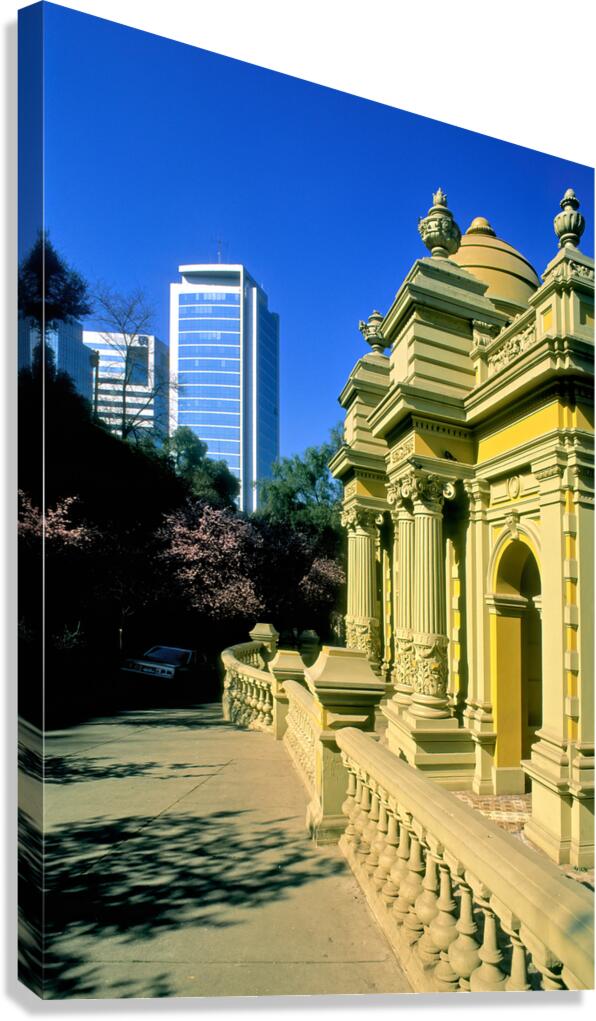 Historic architecture contrasts with modern high rise buildings.