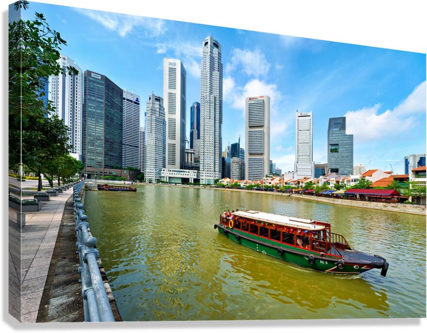 People enjoy boat trip on river in downtown Singapore