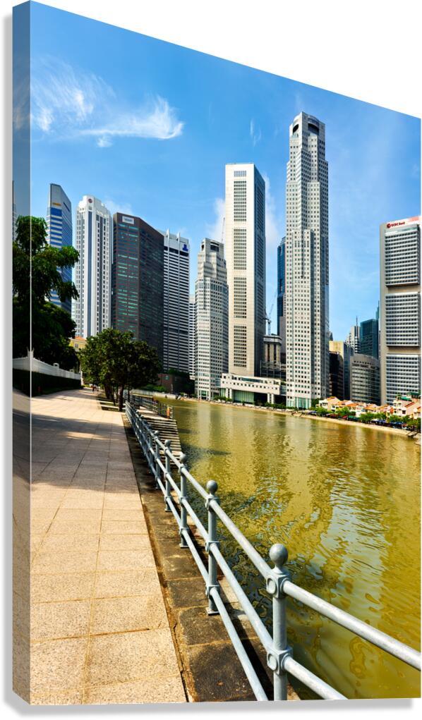 People walk along the canal in Singapore