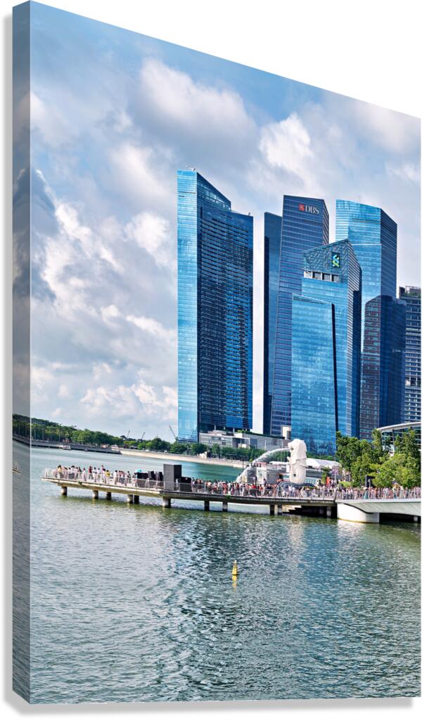 People walk near bridge in Singapore financial district with bui